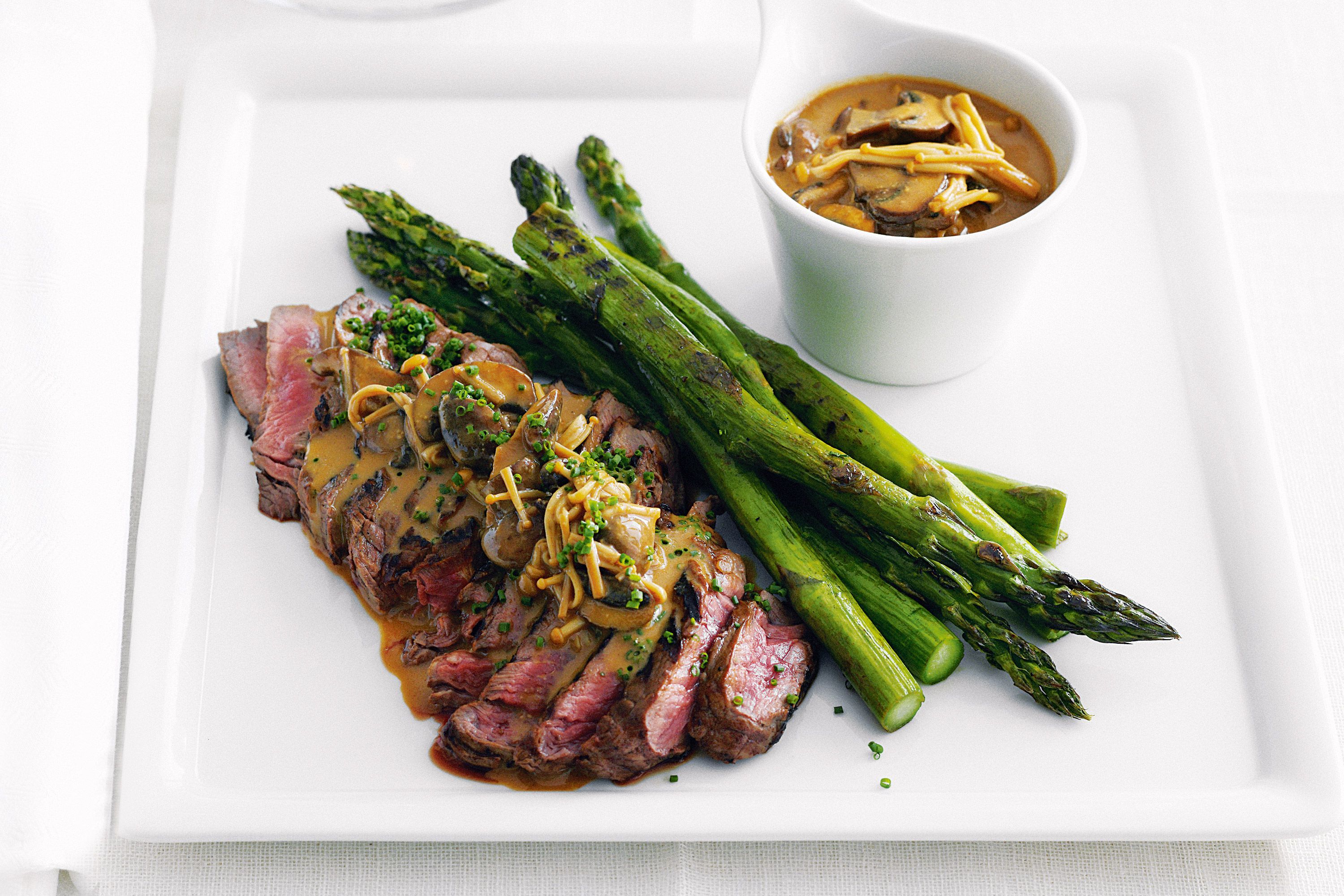 Steak with chips, vegetables and miso mushroom sauce